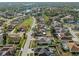 An aerial view of a residential community with well-maintained homes and lush greenery at 22516 Magnolia Trace Blvd, Lutz, FL 33549