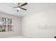 Bedroom showcasing a ceiling fan and window at 22516 Magnolia Trace Blvd, Lutz, FL 33549