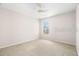 Bright bedroom with carpet, a window, and a ceiling fan at 22516 Magnolia Trace Blvd, Lutz, FL 33549