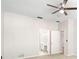 Bright main bedroom with a fan and an en-suite bathroom at 22516 Magnolia Trace Blvd, Lutz, FL 33549