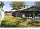Backyard with a fenced-in pool area and grassy lawn at 2332 Seward Dr, Sarasota, FL 34234