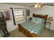Bright bedroom featuring a tropical themed bed and a charming window bringing in natural light at 2332 Seward Dr, Sarasota, FL 34234