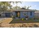Charming single-story home featuring a cozy front porch and an attached two-car garage at 2332 Seward Dr, Sarasota, FL 34234