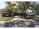 Charming home with mature trees and a driveway at 2332 Seward Dr, Sarasota, FL 34234
