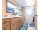 Bathroom featuring a large vanity, bright lighting and colorful decor at 2466 Lake View Blvd, Port Charlotte, FL 33948