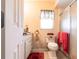 Neat bathroom featuring a vanity, toilet, and shower with a glass door at 2466 Lake View Blvd, Port Charlotte, FL 33948