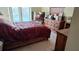 Comfortable bedroom with natural light, dresser, and sliding glass doors to the pool area at 2466 Lake View Blvd, Port Charlotte, FL 33948