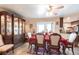 Elegant dining room with a large cabinet, stylish chairs, and a view into the kitchen at 2466 Lake View Blvd, Port Charlotte, FL 33948