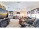 Spacious living room featuring a ceiling fan, large windows, and comfortable seating at 2466 Lake View Blvd, Port Charlotte, FL 33948