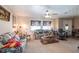 Bright living room with a ceiling fan, neutral tones, and ample seating at 2466 Lake View Blvd, Port Charlotte, FL 33948