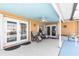 Inviting covered patio featuring comfortable seating and offering a relaxing outdoor space at 2466 Lake View Blvd, Port Charlotte, FL 33948