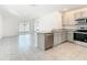 Modern kitchen with stainless steel appliances, granite countertops, and sleek cabinetry at 2871 Common Fig Run, Wesley Chapel, FL 33543