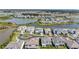Aerial view of a residential community featuring large homes, well-kept lawns, and scenic ponds at 33759 Ocean Spray Ln, Wesley Chapel, FL 33543