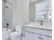 Clean bathroom with white cabinets, marble countertop, and bronze fixtures at 33759 Ocean Spray Ln, Wesley Chapel, FL 33543