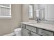 Bathroom features modern vanity with framed mirror and lots of natural light at 33759 Ocean Spray Ln, Wesley Chapel, FL 33543