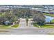 A grand community entrance showcasing lush landscaping and serene water features at 33759 Ocean Spray Ln, Wesley Chapel, FL 33543