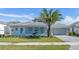 Charming one-story home featuring manicured lawn, decorative shutters, and a well-kept exterior at 33759 Ocean Spray Ln, Wesley Chapel, FL 33543