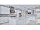 Modern kitchen featuring a center island, marble countertops, and stainless steel appliances at 33759 Ocean Spray Ln, Wesley Chapel, FL 33543