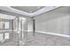 Spacious living area with marble floors, recessed lighting, and access to other living spaces at 33759 Ocean Spray Ln, Wesley Chapel, FL 33543