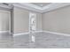 Expansive main bedroom with marble floors, tray ceiling, and adjoining bathroom at 33759 Ocean Spray Ln, Wesley Chapel, FL 33543