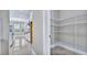 Walk-in pantry with floor to ceiling metal shelving for easy storage at 33759 Ocean Spray Ln, Wesley Chapel, FL 33543