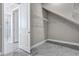 Empty walk-in closet featuring wire shelving and marble tile flooring, ready for custom storage at 33759 Ocean Spray Ln, Wesley Chapel, FL 33543