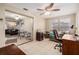 Bedroom with a ceiling fan and natural light from windows and sliding glass doors at 3649 Bradford Dr, Holiday, FL 34691