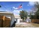 Spacious backyard with a fence, shed, and American flag at 4019 W Lemon St, Tampa, FL 33609