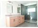 Modern bathroom with double vanity, stylish mirrors, and a spacious walk-in shower at 4019 W Lemon St, Tampa, FL 33609