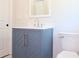 Bathroom with a blue sink cabinet and white toilet at 4019 W Lemon St, Tampa, FL 33609