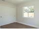 Bedroom with hardwood floors, a window, and a closet at 4019 W Lemon St, Tampa, FL 33609
