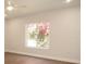 Bright bedroom with a large window offering a view of blooming trees and natural light at 4019 W Lemon St, Tampa, FL 33609
