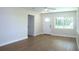 Bright living room featuring wood floors, fresh paint, and natural light at 4019 W Lemon St, Tampa, FL 33609