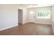 Well lit open concept living room with hardwood floors and views out the windows at 4019 W Lemon St, Tampa, FL 33609