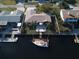Waterfront home featuring a private boat dock and a spacious patio, perfect for outdoor entertaining at 4108 Daisy Dr, Hernando Beach, FL 34607