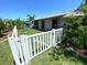Fenced backyard showcasing lush green lawn and a serene canal view at 4108 Daisy Dr, Hernando Beach, FL 34607
