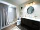 Bathroom features include shower, vanity with sink, mirror and decor at 4108 Daisy Dr, Hernando Beach, FL 34607