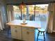 Kitchen island with seating with view of waterway with boat dock and boats at 4108 Daisy Dr, Hernando Beach, FL 34607