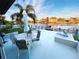 Outdoor patio area with waterfront views, stylish furniture, and a private boat dock at 4108 Daisy Dr, Hernando Beach, FL 34607