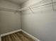 Empty closet with new floor and shelving at 4312 Lithia Pinecrest Rd, Valrico, FL 33596