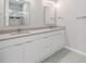 Bathroom featuring double sinks and a large mirror at 510 N Hubert Ave # 4B, Tampa, FL 33609