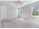 Spacious bedroom with large windows and neutral carpeting at 510 N Hubert Ave # 4B, Tampa, FL 33609