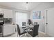 Cozy dining area with natural light and views of the backyard at 5211 Gato Del Sol Cir, Wesley Chapel, FL 33544