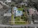 Drone shot reveals the home's pool, cabana, lush lawn and long private driveway at 524 Park S St, St Petersburg, FL 33707