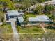 A full-property aerial showcases the home's landscaped yard, detached garage, stone facade and street view at 524 Park S St, St Petersburg, FL 33707