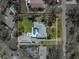 Aerial view of property showcasing pool, outdoor seating, spacious lawn and a private driveway at 524 Park S St, St Petersburg, FL 33707