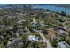 Expansive aerial view of a waterfront community showcasing homes, lush landscaping, and water views at 524 Park S St, St Petersburg, FL 33707