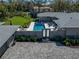 Aerial view of a home featuring a pool, outdoor patio area, and brick driveway at 524 Park S St, St Petersburg, FL 33707