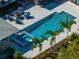 Aerial view of a stunning pool, spa, and patio area with lush landscaping and ample seating at 524 Park S St, St Petersburg, FL 33707