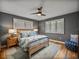 Bedroom features hardwood floors, plantation shutters, and a comfortable king-sized bed at 524 Park S St, St Petersburg, FL 33707